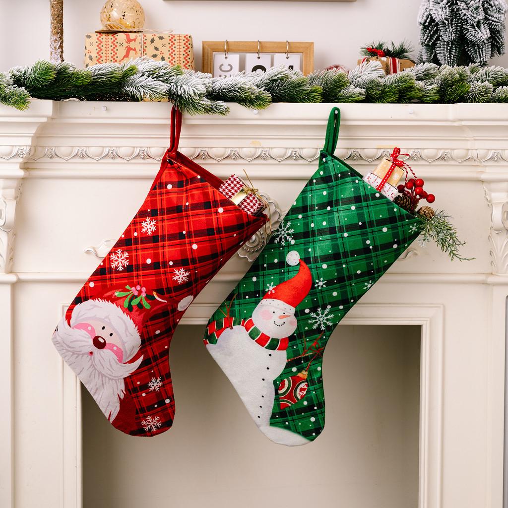 Christmas Playful Stockings In Rich Red And Green Fabric Featuring Snowflakes And Holiday Characters
