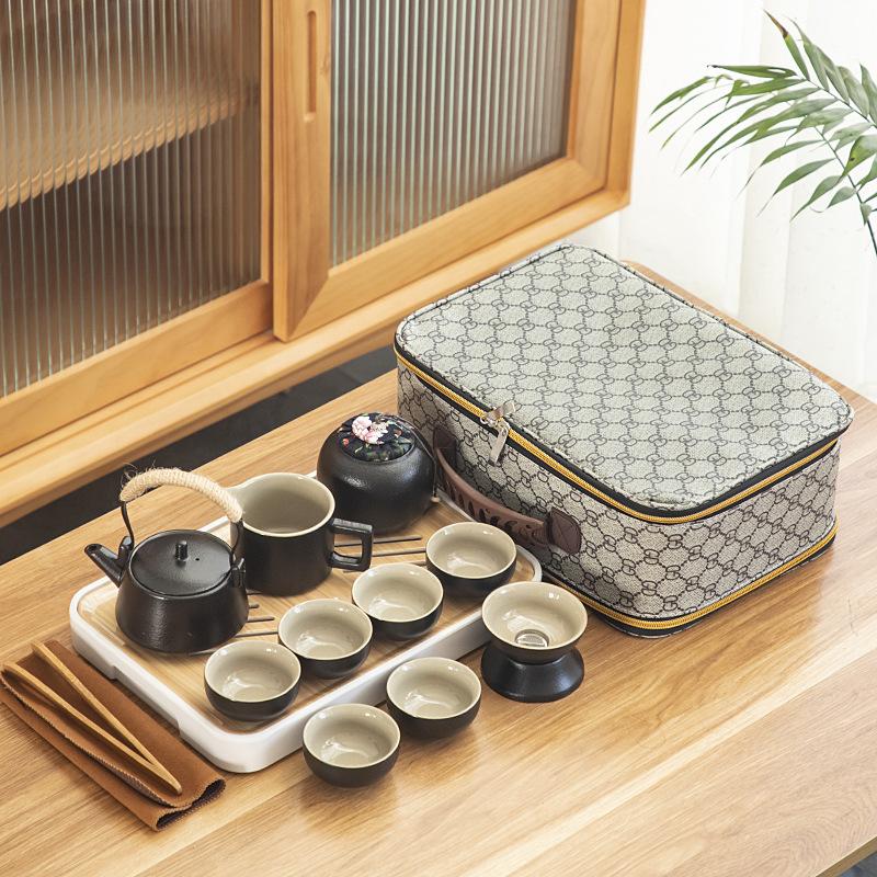 Black pottery travel kung fu tea set portable business gift set creative ceramic cooling pot set