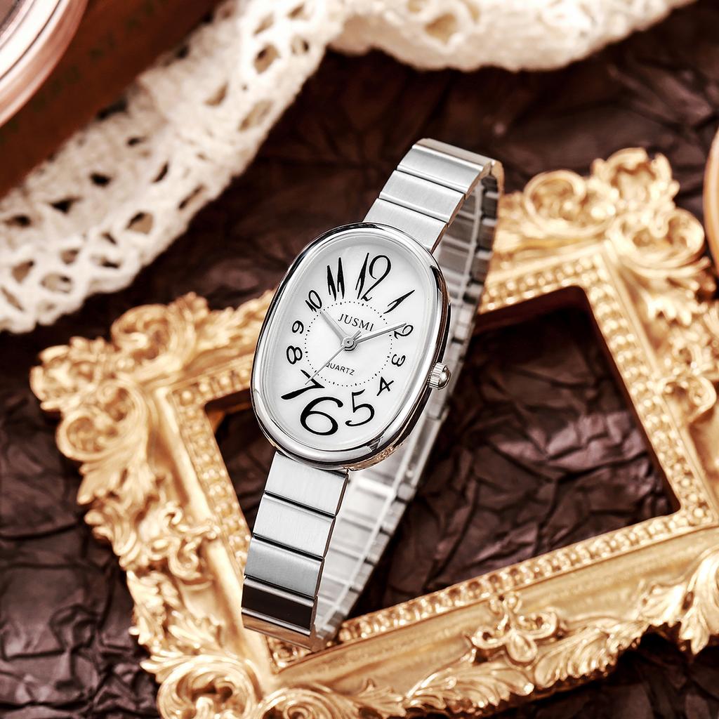 Ladies' exquisite and high-value Arabic numeral scale oval dial bamboo style steel strap quartz watch.