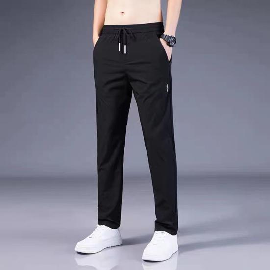 Men Pants Solid Color Drawstring Mid Waist Pockets Loose Streetwear Straight Working Trousers for Daily Wear