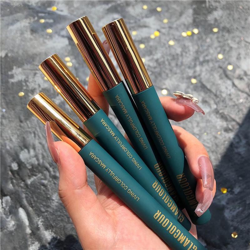 Magic Lash: Waterproof & Smudge-Proof Volumizing Mascara with Curling and Lengthening Small Brush Head.