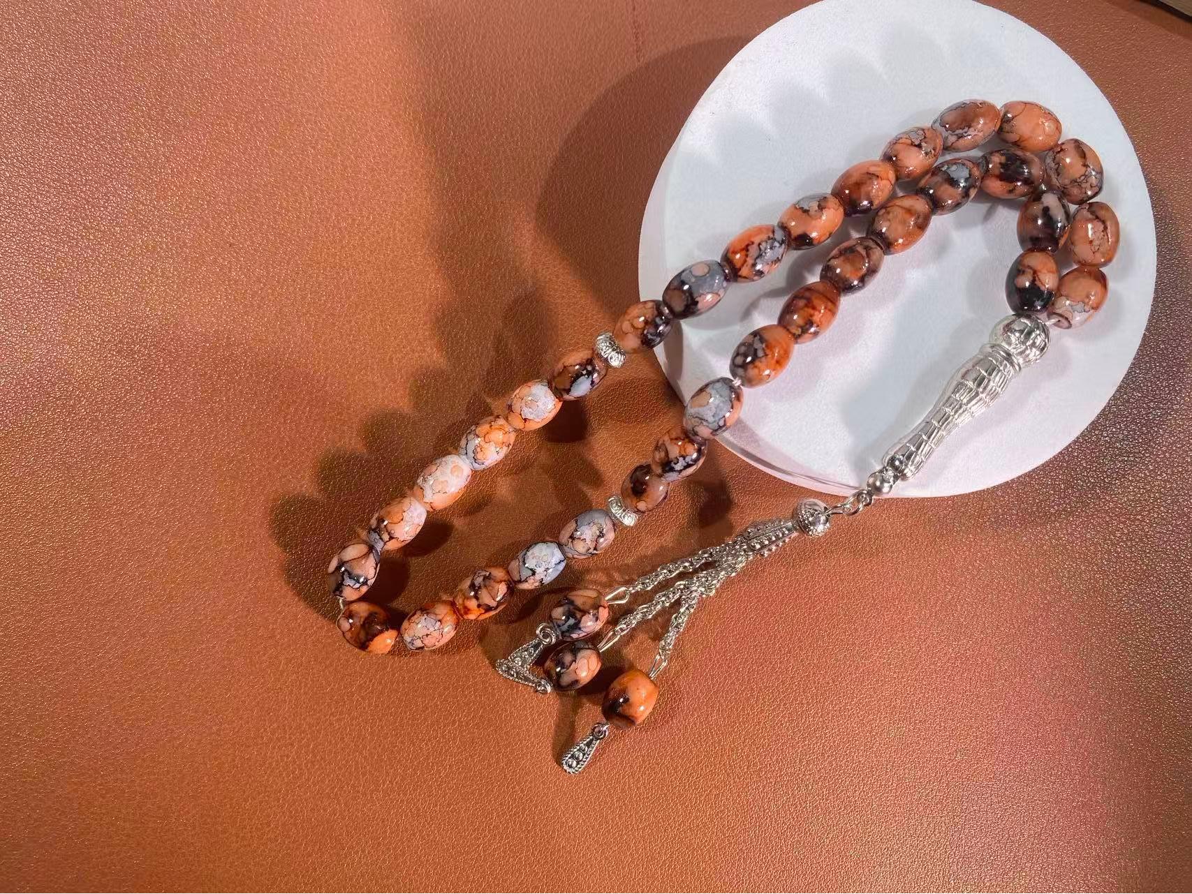 

Classic 33-Bead 10mm Glass Firecracker Muslim Prayer Beads with Iron Tassel Bracelet (Tasbih) бурштин/сірий