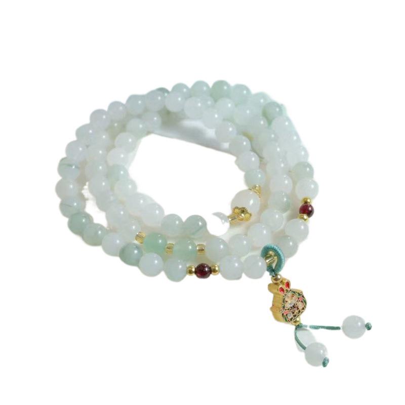 Golden Silk Jade Bracelet: Women's Xinjiang Tianshan Green Jade with Floating Flower Design and Barrel Beads.