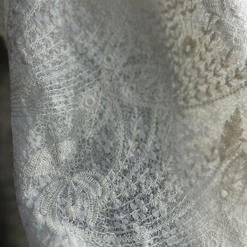 Retro patterned tattoo fabric with base of floral design suitable for wedding dresses formal gowns and designer clothing fabrics