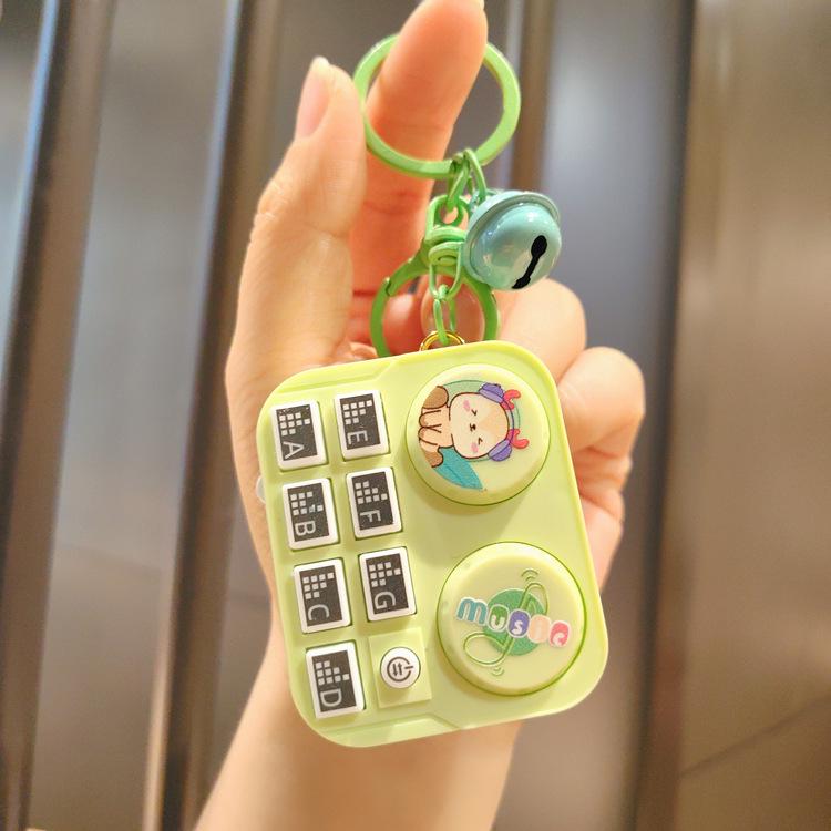 Leuchtender Mini-DJ-Mixer Schlüsselanhänger: Cartoon Musik-Spielkonsolen-Anhänger