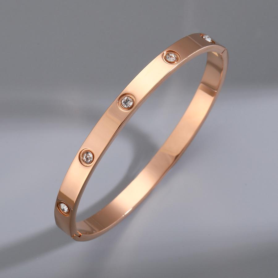 

Женский браслет-бенгл из титана цвета розового золота с цирконом - Нишевый браслет класса люкс