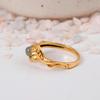 Delicate Leaf Wrap Gold Labradorite Ring: Nature-inspired gemstone jewelry with a small, iridescent stone and sculpted leaf band.