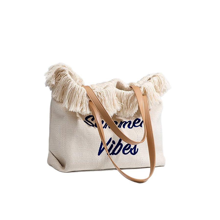 Korean Canvas Embroidered Tote: Versatile Women's Woven Beach Handbag with Tassel