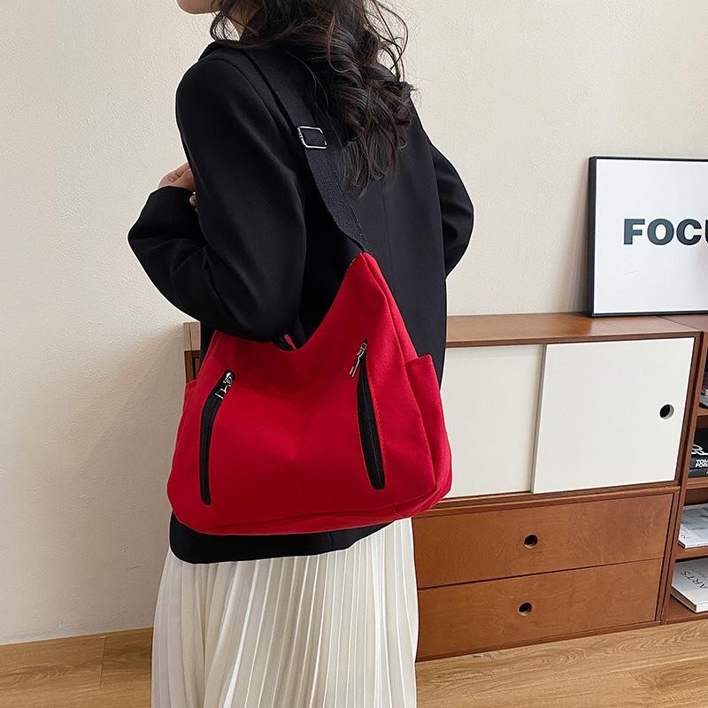 New simple trend Korean version messenger bag women's shopping with change bag niche design shoulder women's bag