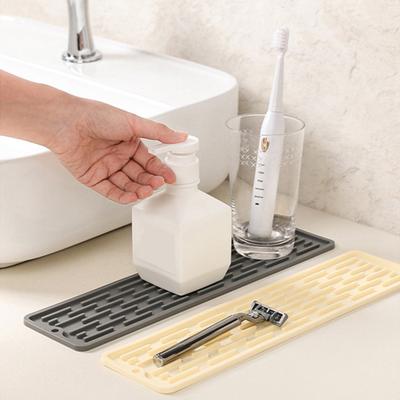 Rutschfeste Silikon-Wasserhahnmatte Wasserdichte Spülbecken-Abflussmatte Umwickelndes Design Küchenarbeitsplatten-Schutz Trockner Seife Zahnbürstenhalter Spritzschutz