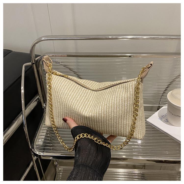 2025 new holiday style straw weaving women's summer popular weaving seaside beach large capacity chain shoulder tote bag