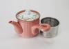 This lightweight teapot features a hand-painted floral lid, a 9cm diameter, and a 350ml capacity. Its delicate pink design features a long,