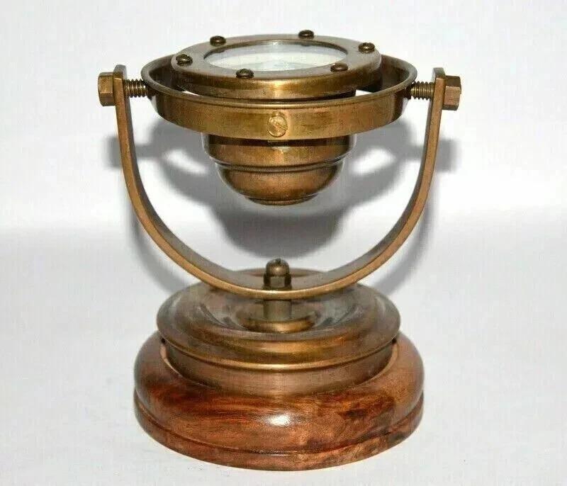 

antique brass nautical gimbal compass is a must-have for maritime enthusiasts an коричневий