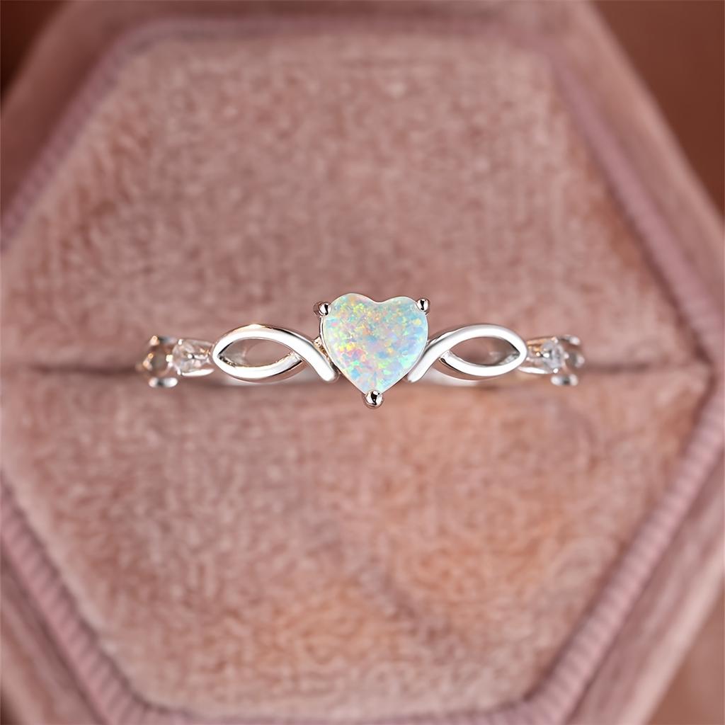 Bague couleur argent incrustée d'opale brillante en forme de cœur argentée ou rose dorée. Choisissez la couleur que vous préférez. Cadeau de Saint-Valentin de haute qualité pour femme.