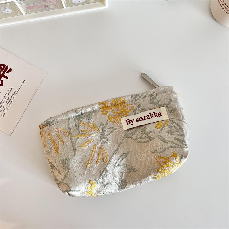 Trendy Ladies Simple And Portable Floral Embossed Cosmetic Bag For Use Everyday