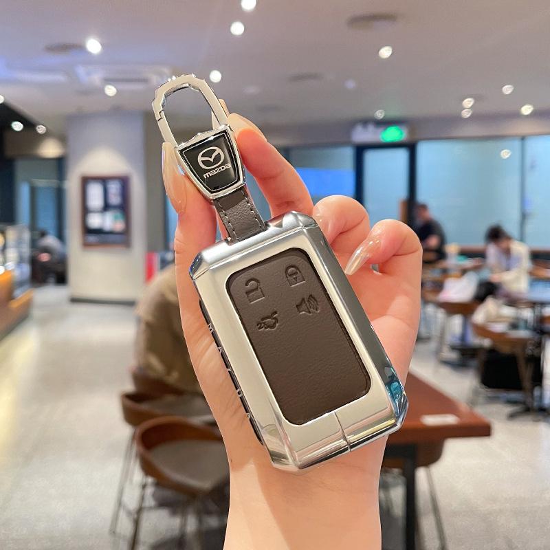 Kuooo: Wear-resistant, fully enclosed Mazda EZ6 key fob and EZ60 car remote protective cases with buckle.