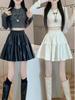 Melade Coffee Pleated PU Leather A-line Skirt with Anti-exposure Fluffy Design