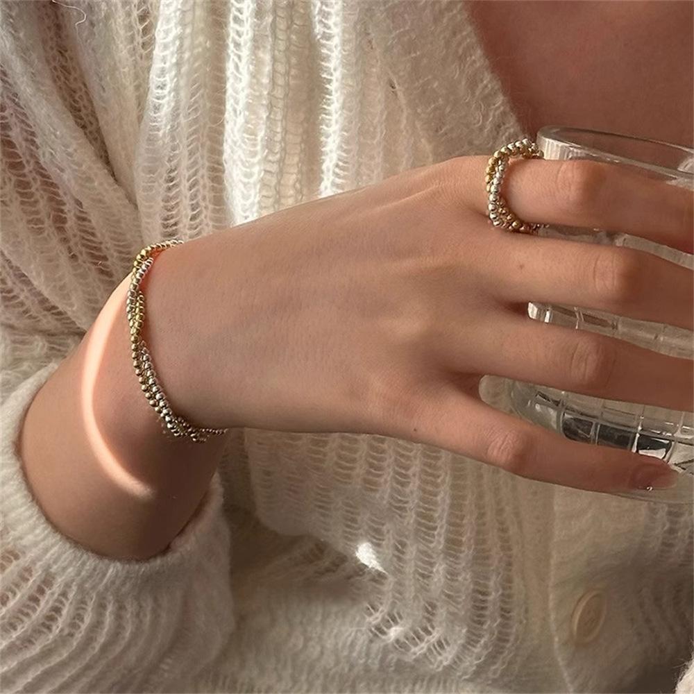 Gold and silver contrasting color round bead interwoven ring cold wind niche temperament light luxury simple elastic rope ring