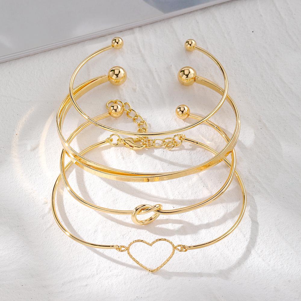 European & American Love Knot Alloy Bracelet Set: 4-Piece Creative Geometric Heart Design