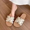Xiaoxiangfeng flat-bottomed slippers women's summer 2025 new outer wear fashion pearl soft-bottomed French with skirt cool slippers