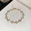 Rhinestone Clover Flower Bracelet: Elegant Retro Design with a Light, Luxurious Touch