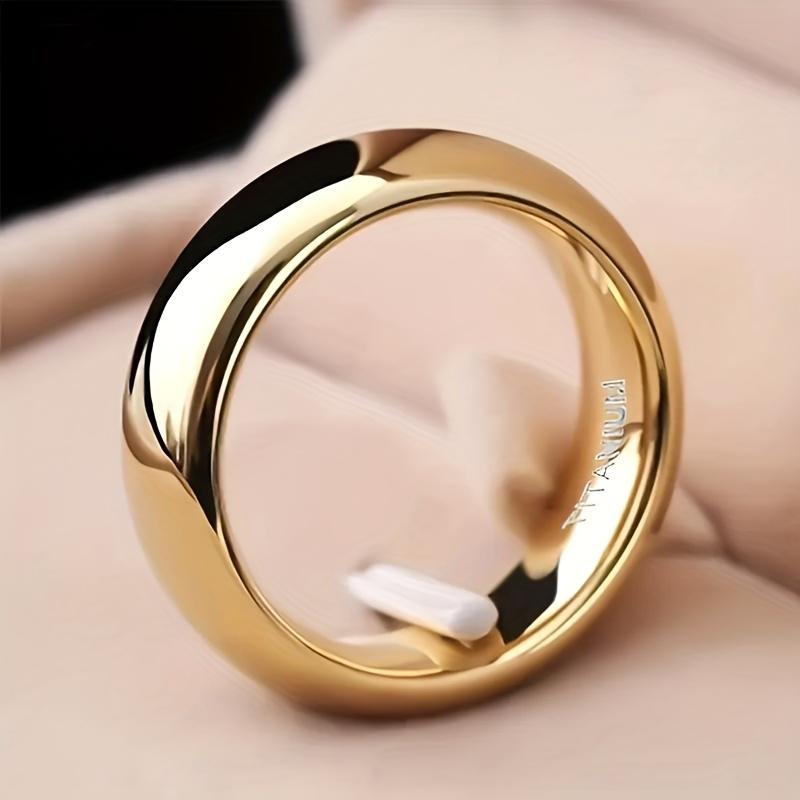 Ring in a Golden Gloss End, Featuring a Modern Minimalist Design Suitable for Weddings And Everyday Use. Showcasing a Stylish Polished Surface