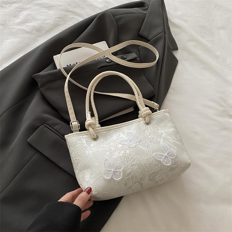 Minimalistische Spitzen-Schmetterlings-Handtasche mit Stickereien für Sommer-Casual-Outfits