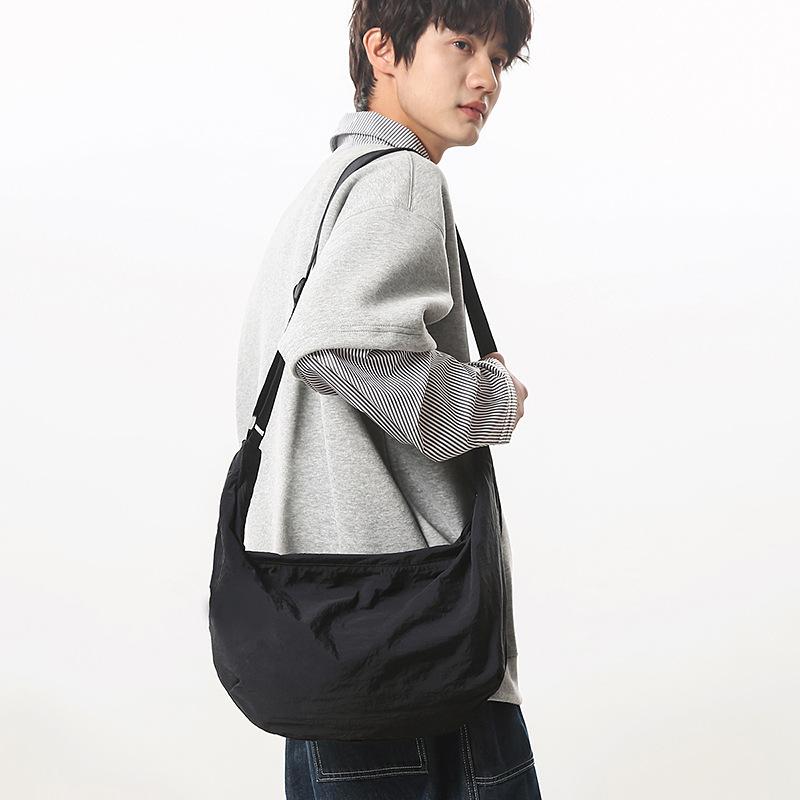 2025 dumpling bag women's simple solid color lazy wind large capacity student shoulder bag men's class Korean version messenger bag bag