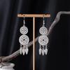 Bohemian Ethnic Miao Silver Tassel Earrings with Butterfly, Peacock, and Flower Design for Women – Long Dangle Jewelry for Travel Photos.