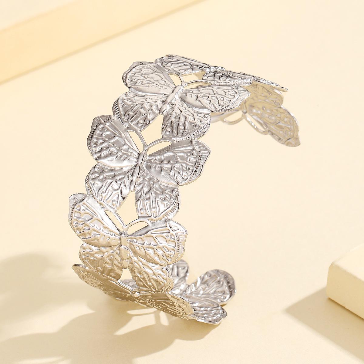 Gold-Plated Retro Animal Cuff Bracelet: Butterfly Design, Stainless Steel, Fade-Resistant.