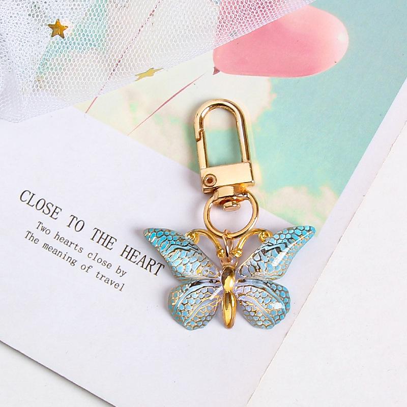 Gradient Butterfly Pendant: Iridescent Keychain Charm for Backpack or Earphone Case.