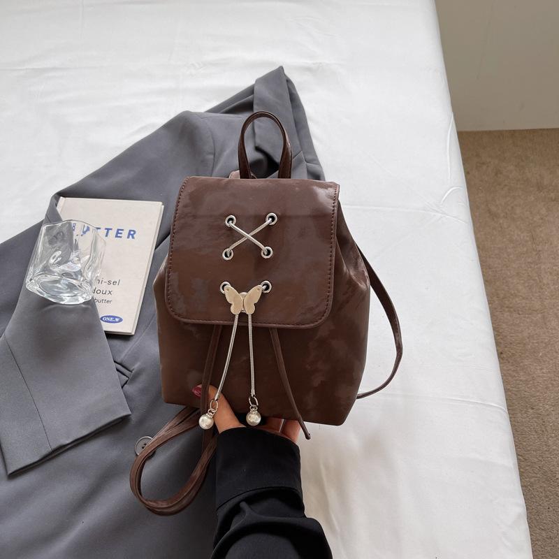 

Повседневный рюкзак женский новый универсальный студенческий школьный рюкзак с бантом легкий дорожный рюкзак на плечо темно-коричневого