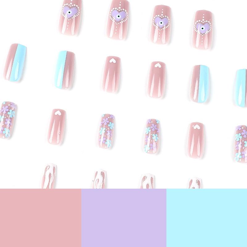 White Flame & Polka Dot Press-On Nails with Gold Glitter, Heart Designs, and Light Blue Flowers.