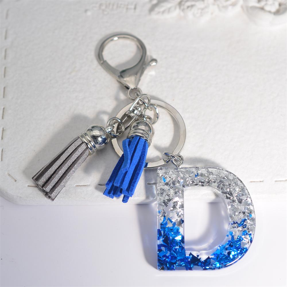 Креативные брелки из смолы с 26 буквами и кисточками — фото 11