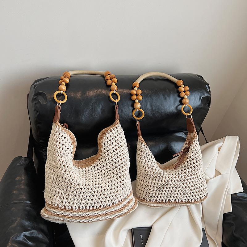 Holiday style woven bag women's 2025 new knitted hollow shoulder bag fashionable large-capacity messenger bag beach bag