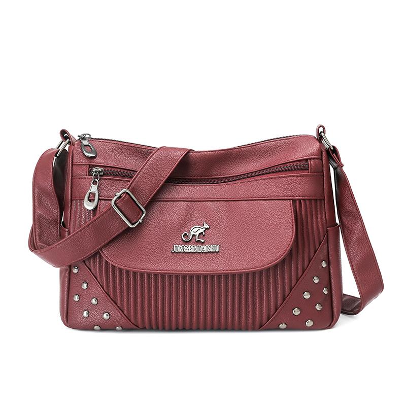 Einfarbige Damen Crossbody-Tasche mit geripptem Panel und Nieten-Details Elegante Kunstleder-Umhängetasche für den täglichen Gebrauch