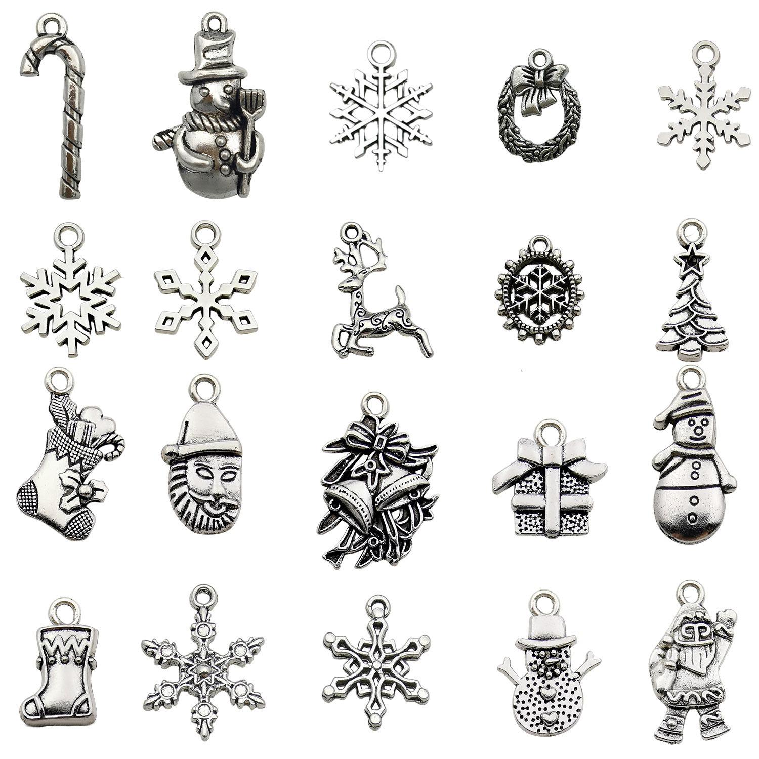 100-teiliges Weihnachts-Tropföl-Legierungs-Schmuckzubehör: Weihnachtsmann, Schneemann, Glocke, Rentier Anhänger für DIY Armbänder.