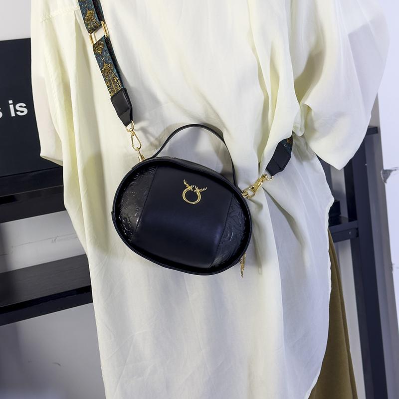 A refined PU shoulder bag in the shape of a solid rugby ball, suitable for keys, mobile phones, cosmetics and jewelry
