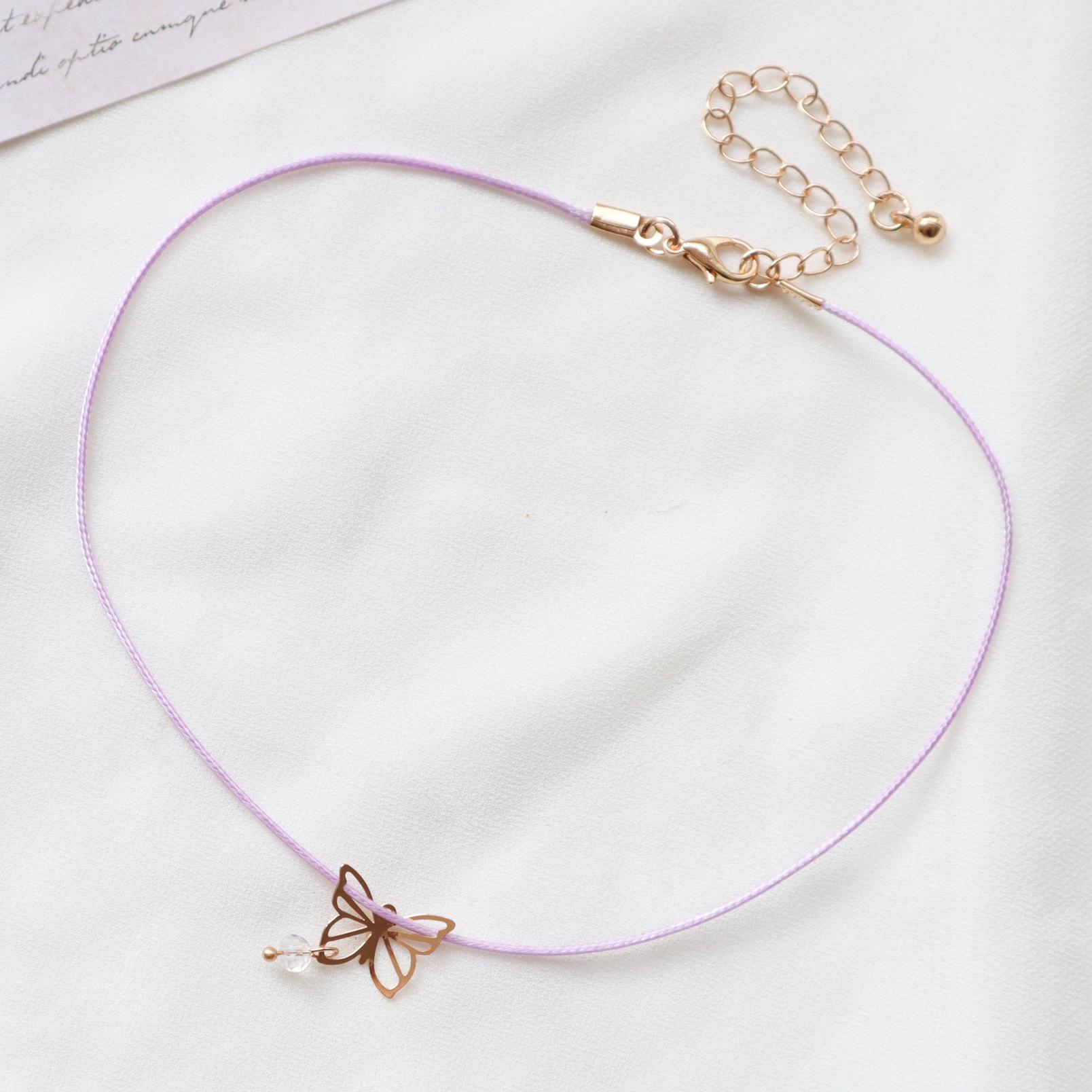 

Фіолетове квіткове намисто-чокер з підвіскою у вигляді банта з стрічки - казковий стиль для жінок