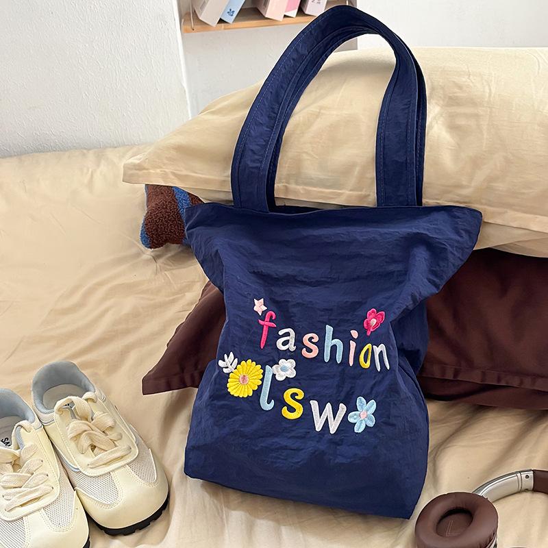 

Fashion trend casual simple personality foreign style canvas bag 2025 summer new women s texture shoulder armpit bag темно-синий