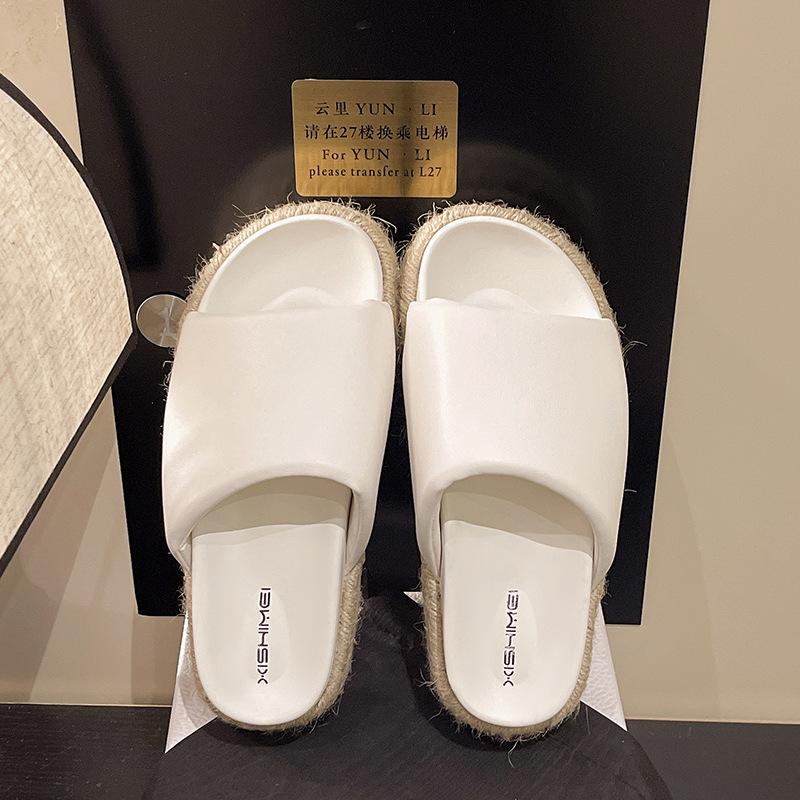 Summer vacation style straw woven thick bottom slope heel round head one and a half word drag versatile outside wearing open toe cool slippers women