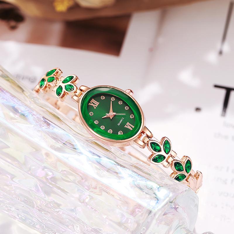 Luxury Rhinestone Women's Wristwatch with Round Dial and Colored Diamond Bracelet.