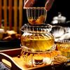 European Glass Tea Infuser Set: Includes Teapot with Filter, Glass Cups, and Saucers for Brewing Flower Tea.