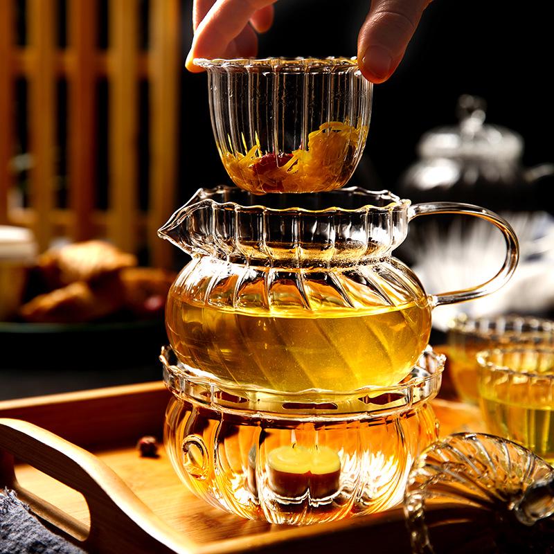 European Glass Tea Infuser Set: Includes Teapot with Filter, Glass Cups, and Saucers for Brewing Flower Tea.