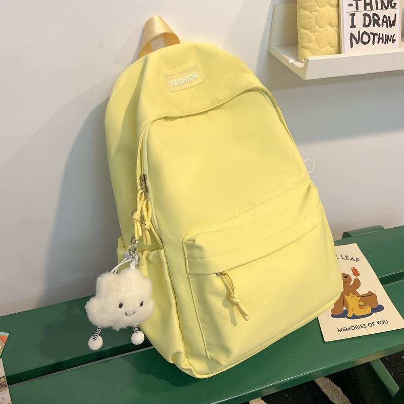 The schoolbag is fresh and sweet, and the solid color is versatile and simple. The schoolbag for junior high school students is light