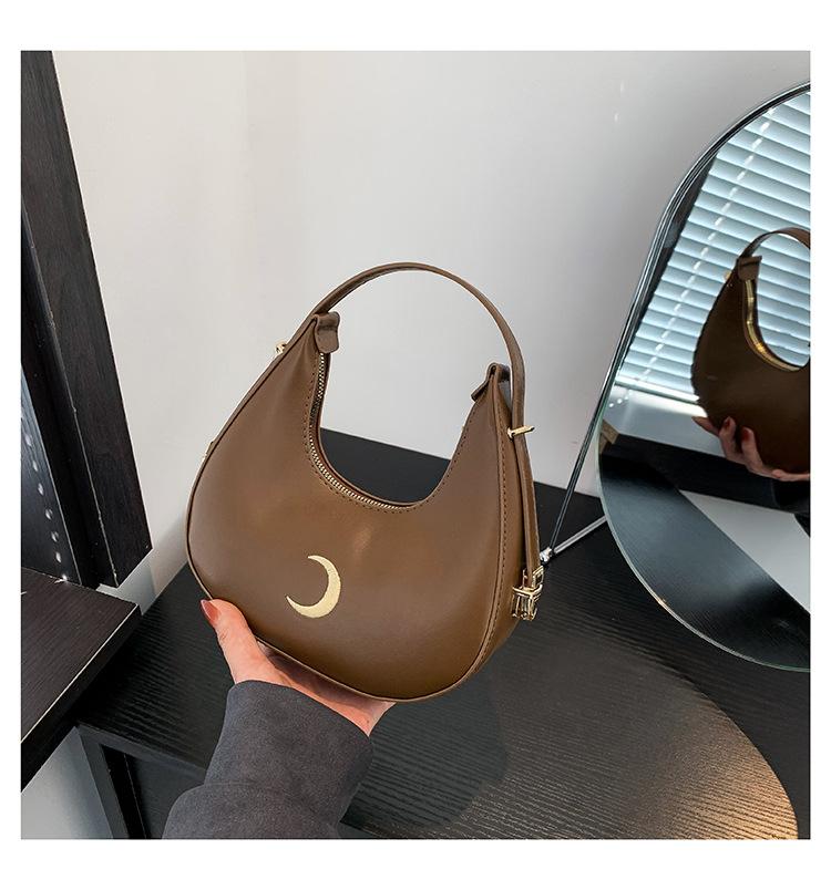 

Модна сумка на одне плече під пахвою, сумка-півмісяць, нова сумочка ранньої весни 2024 року, сумка-пельмень, універсальна популярна ins жіноча сумка темно-коричневого кольору