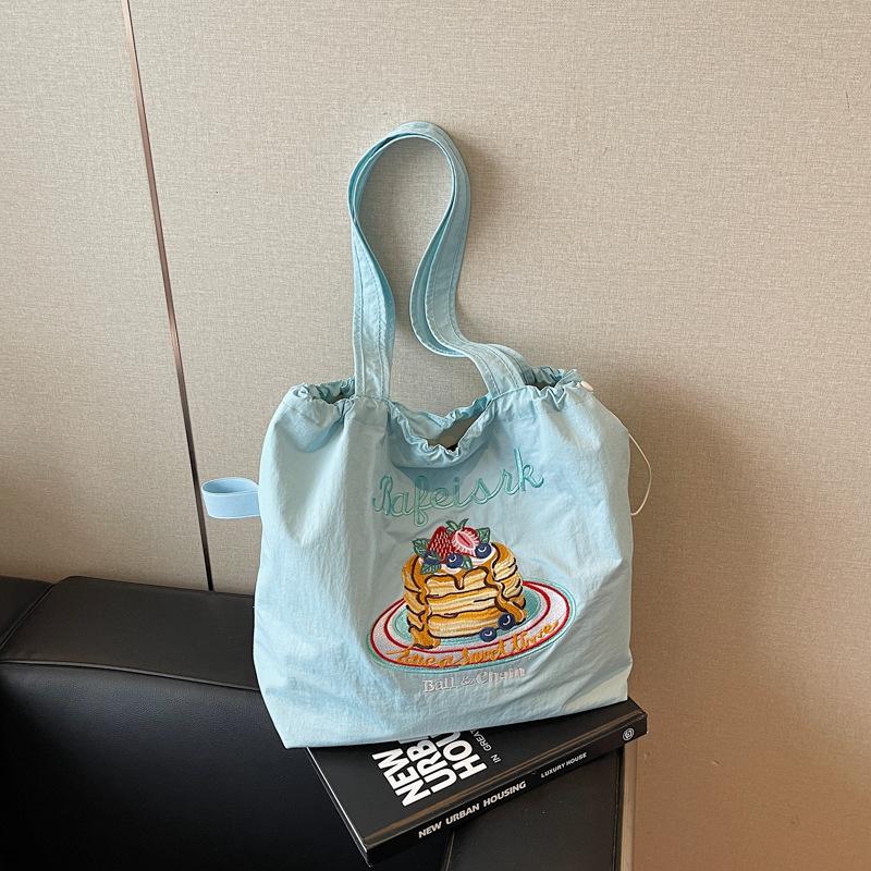 New high-value, fresh, sweet and cute embroidered small bag, casual and simple large-capacity bucket bag.