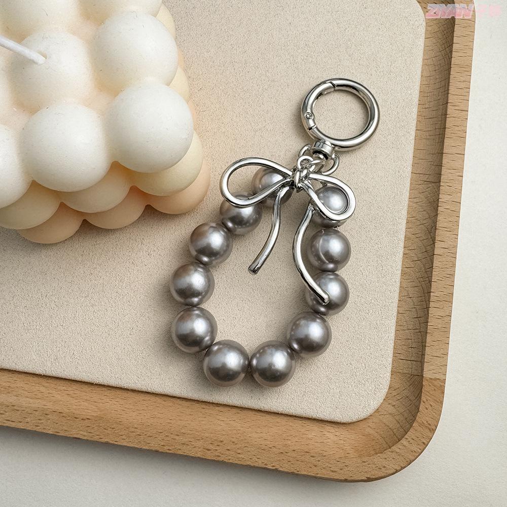 Korean Style Keychain Pendant: Metal Irregular Bow with Pearl Beads for Phone or Bag Accessories