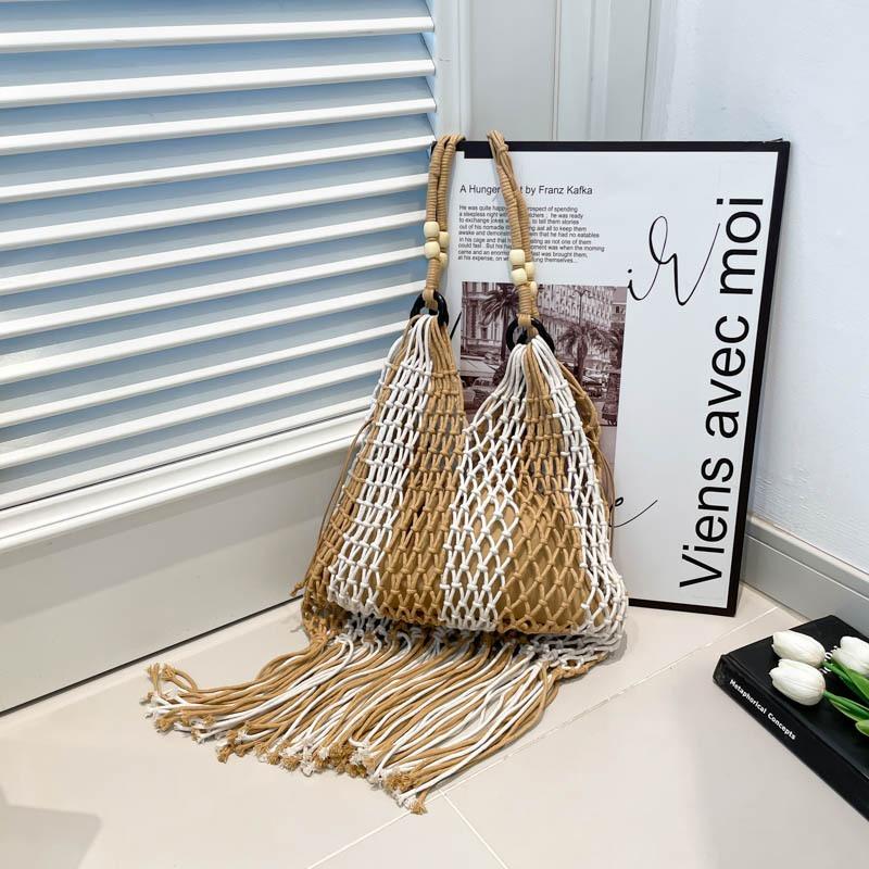 Lazy woven tassel portable shoulder hollow bag beach vacation niche leisure tote bag tide