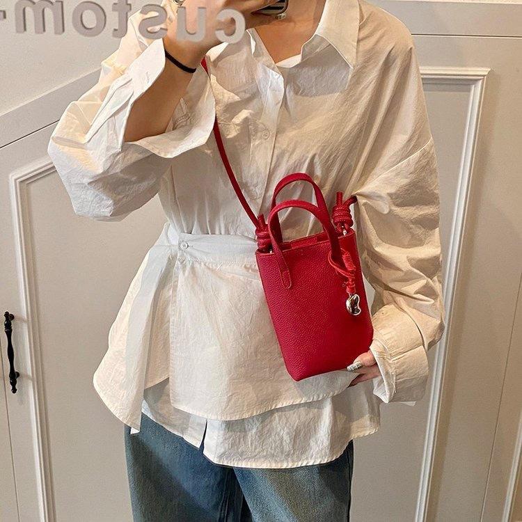 Casual niche design simple women's bag 2025 spring new fashion trend bucket bag shoulder messenger bag